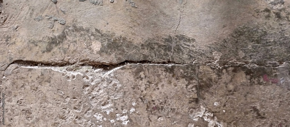 Fototapeta premium Heavily Cracked and Damaged Concrete Ground Surface