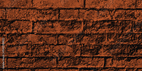 Close-up of a decorative concrete block wall in a deep reddish-brown, highlighting its geometric pattern and textural depth with a shadow.
