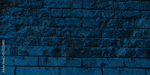 Weather-beaten construction material in a cool blue tone, displaying a coarse grain and the effects of time.
