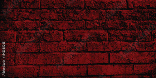 Rustic block wall illuminated by a dark, intense light, revealing its intricate structure and time-worn imperfections with deep shadows.
