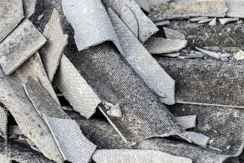 Pile of broken asbestos roof tiles presenting health hazard