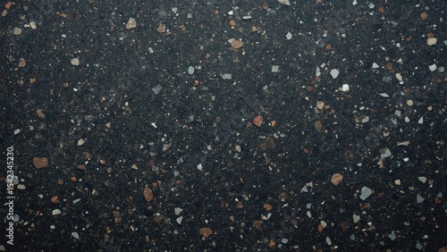 dark colored recycled plastic with visible specks of colorful fragments