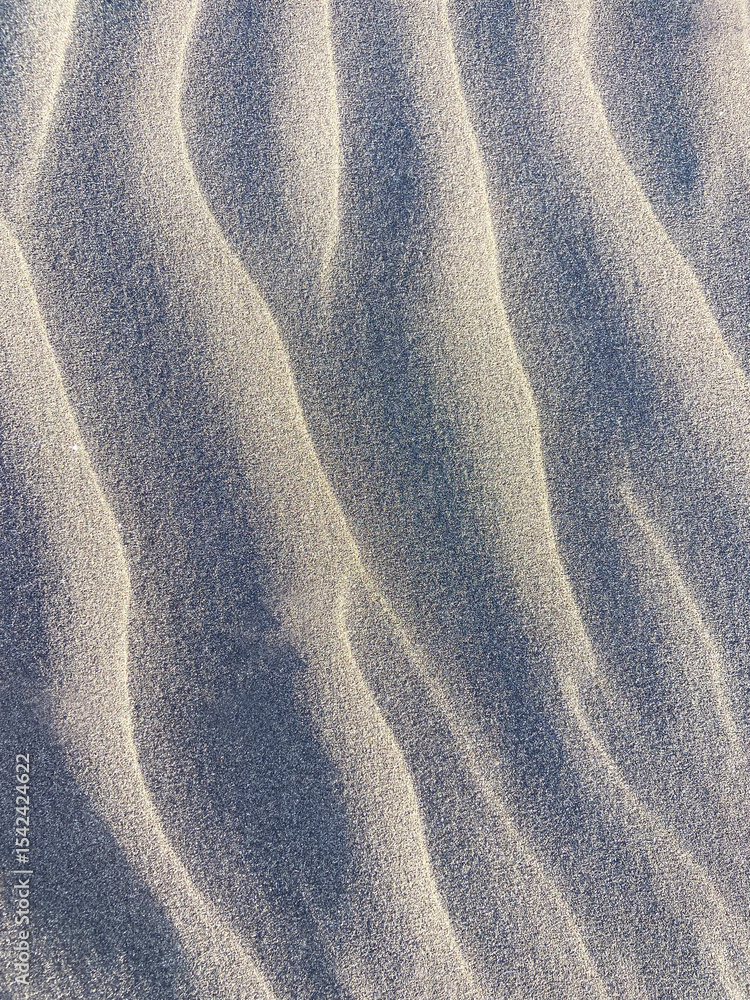 Φωτογραφία Close up of desert volcanic sand pattern texture background in Montana Pelada beach, Tenerife,
Canary Islands,Spain
