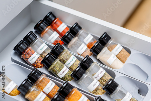 Fototapeta Naklejka Na Ścianę i Meble -  Organized Spice Rack in a Kitchen Drawer