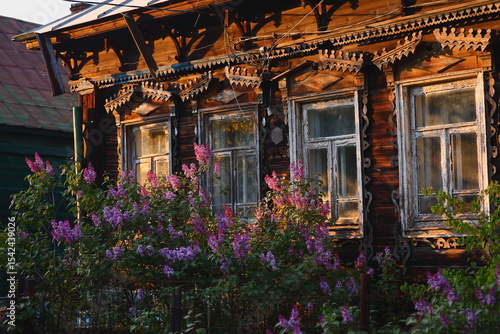 Quadro su tela old house in the village, An old window of an ancient house with lilac flowers