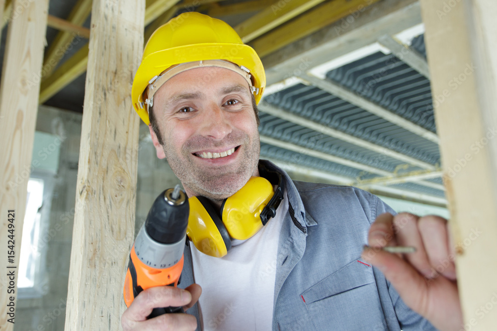 portrait of happy builder man wearing helmet with screwdriver portrait of happy builder man wearing helmet with screwdriver