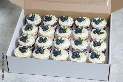 Cardboard box with trifles for delivery to the celebration