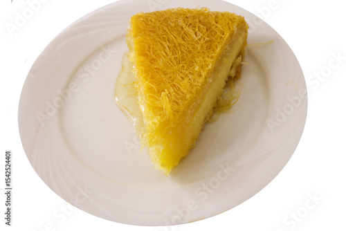 A greek pastry called milk cake in a white plate