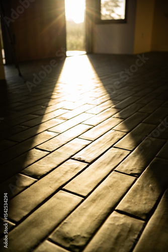tile floor and sunset through window
