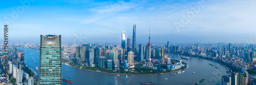 Panoramic Aerial view of Shanghai skyline and winding river on sunny day.