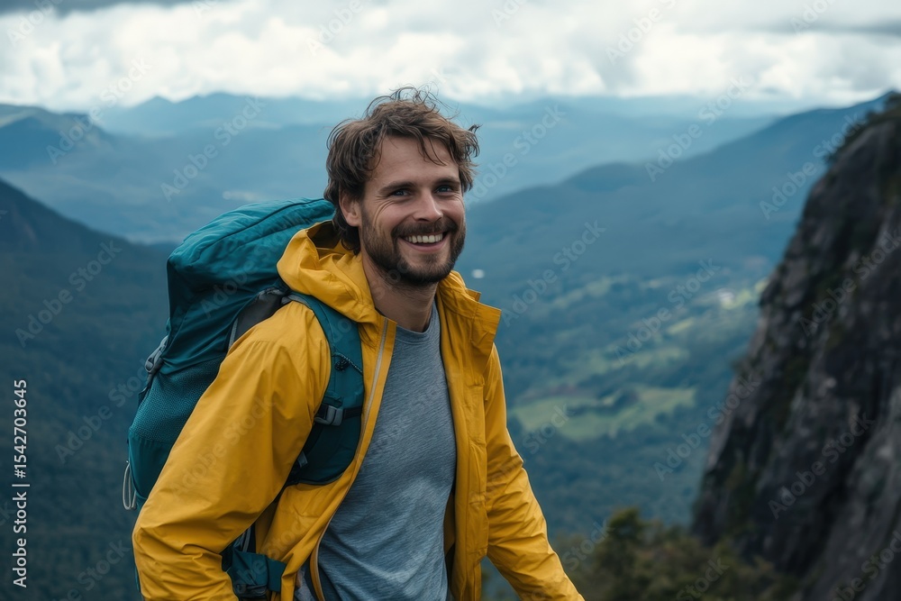 Smiling hiker with a backpack on a mountaintop. Smiling hiker with a backpack on a mountaintop.