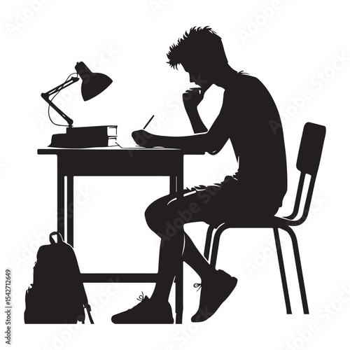 Silhouette of a student studying writing homework at desk