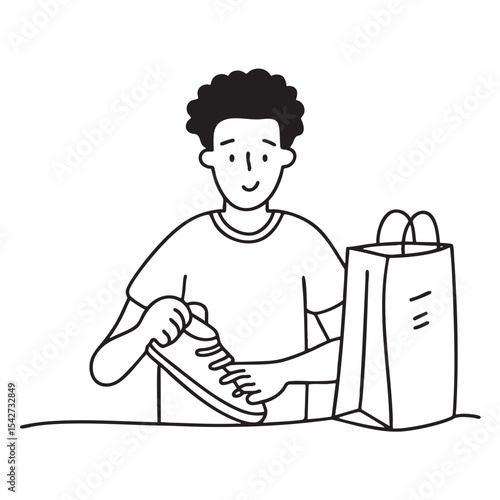 A person unboxing shoes next to a shopping bag