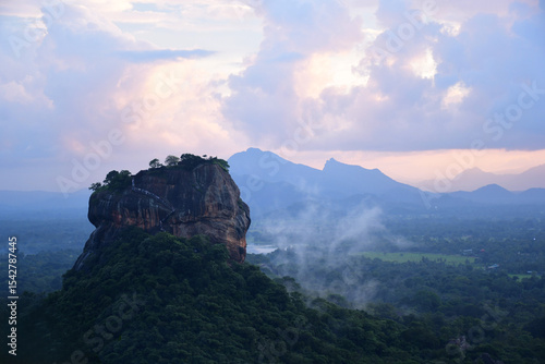 Sigiriya Rock Fortress at Sunrise. Iconic Landmark in Sri Lanka’s Misty Jungle Landscape