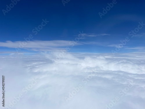 Expansive Cloud Deck Under Azure Sky
