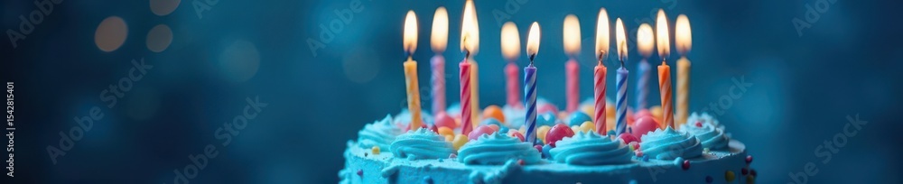 Fototapeta premium Blue frosted birthday cake, burning candles, blue bokeh backdrop, dessert, happy birthday