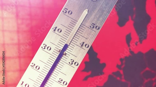 Thermometer and map of Europe in reddish colors symbolize climate change and a heat wave	