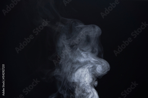 White Smoke Swirls on Black Background for Composite Use
