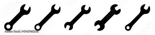 Collection of five different wrenches isolated against a plain white background