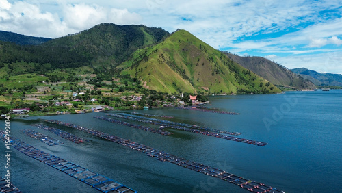 Fotografie Aerial View of Floating Fish Farms on Lake Toba, Karo Highlands