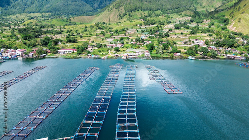 Φωτογραφία Aerial View of Floating Fish Farms on Lake Toba, Karo Highlands