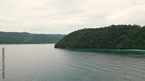 Wallpaper Mural Drone view of tropical beaches and bays on Ko Phi Phi, Thailand, with white sand, turquoise sea, lush hills, and dramatic cliffs under a bright summer sky, ideal for travel. Torontodigital.ca