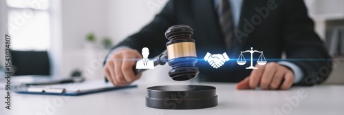 Judge's gavel with legal symbols in a business setting.