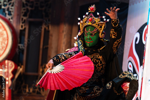 Chinese actor performs a public traditional changing face performance onstage in Chengdu, China