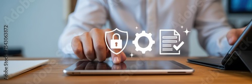Person using a tablet with security and document icons.