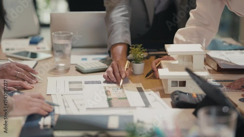 Office team gathers to discuss commercial property strategy and business development