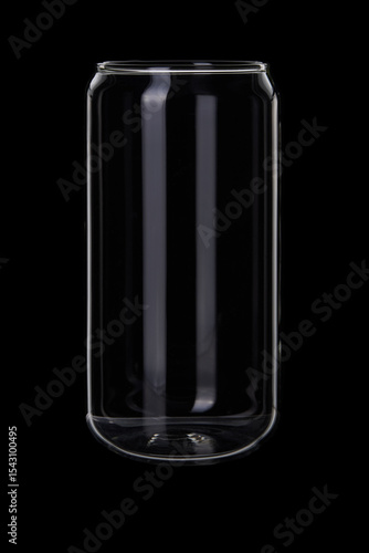 Empty thin glass beverage jar on black background