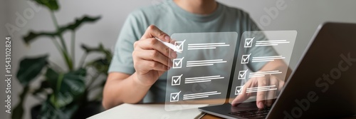 Person working on a digital checklist on a laptop.
