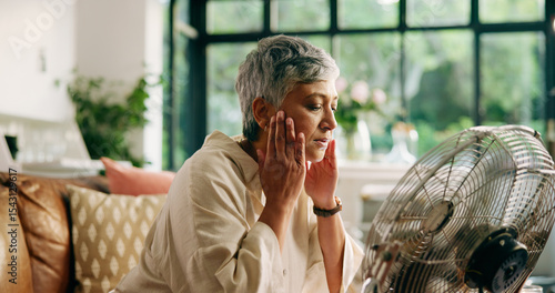 Obraz na plátne Senior woman, hot and fan at house for heatwave, air conditioning and menopause symptoms
