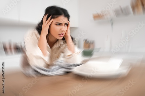 Tired young housewife with ...