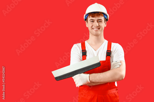 Male decorator with putty k...