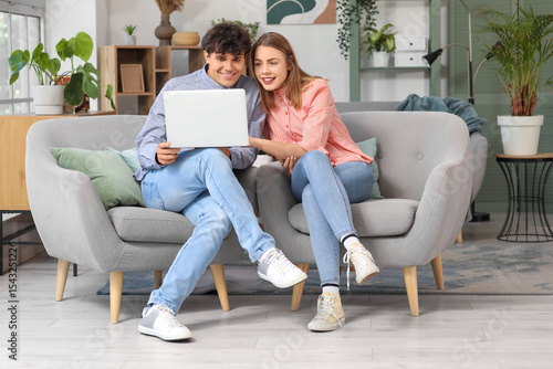 Young couple with laptop sh...