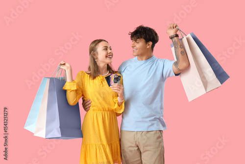 Happy young couple with cre...
