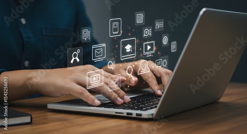 Person using laptop with digital media icons online education technology internet communication work