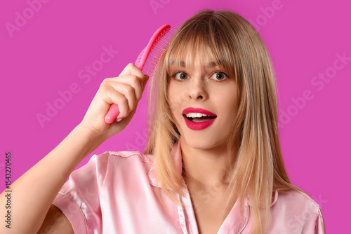 Young woman in pajamas with...