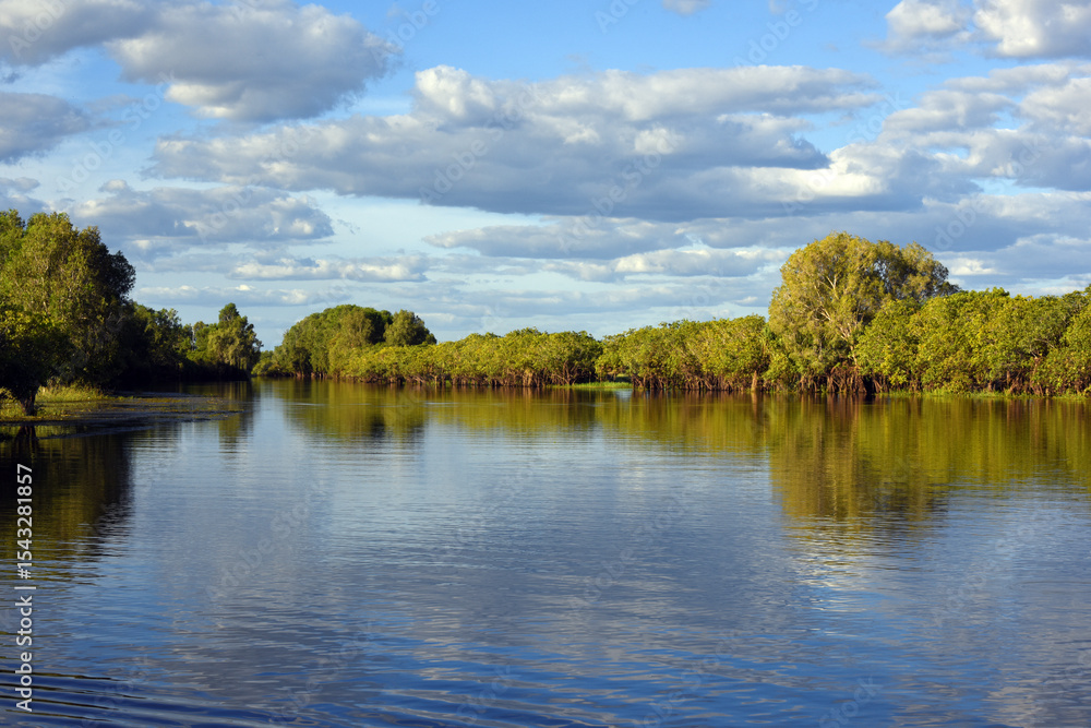 Obraz premium panoramic landscape view to the yellow river billabong in the wetland of Kakadu National Park in the Northern territories of Australia 