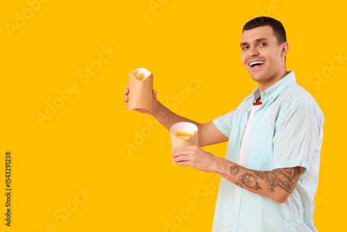 Young man with french fries...