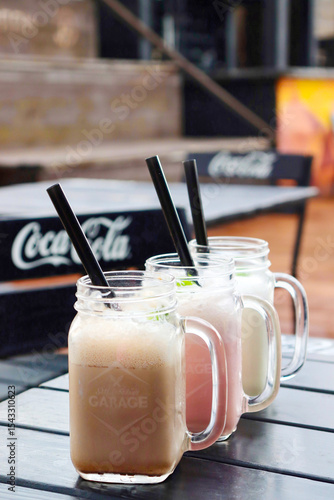 Delicious milkshakes are on the table.