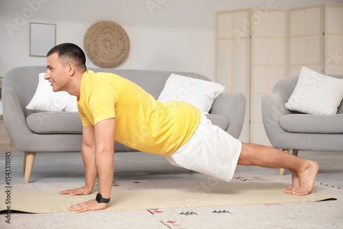 Sporty young man training a...