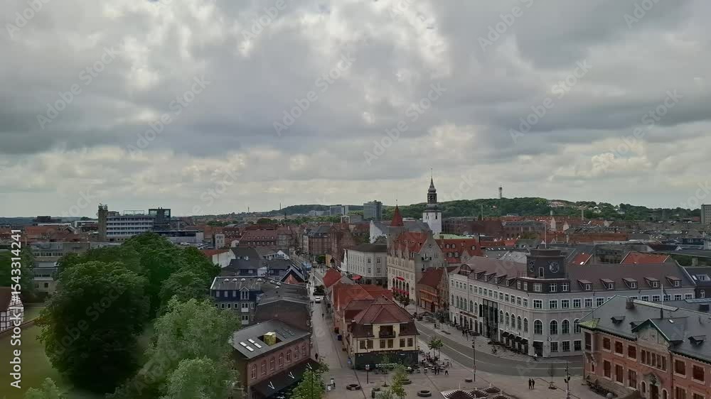 denmark aalborg june 11 2024 Aerial view of a vibrant city square featuring historic buildings, busy streets, and a cloudy skyline. denmark aalborg june 11 2024 Aerial view of a vibrant city square featuring historic buildings, busy streets, and a cloudy skyline.