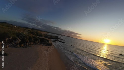 Nature, Coastal landscape, Ocean, Sea, Sand, Shore, Waves, Dunes, Cliff, Trees, Sunshine, Golden hour, Horizon, Tranquility, Scenic view, Wilderness, Seaside, Twilight, Breeze, Natural light, Outdoor 