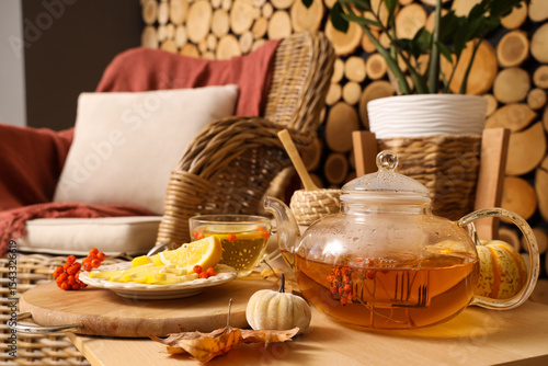 Teapot, cup of green tea wi...