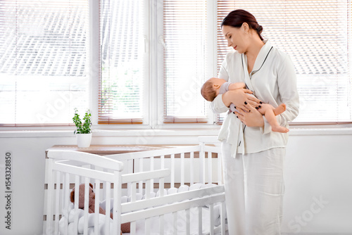 Happy mother holding her cu...