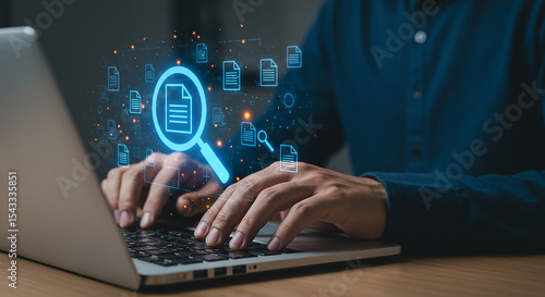 Person searching documents on laptop with digital interface