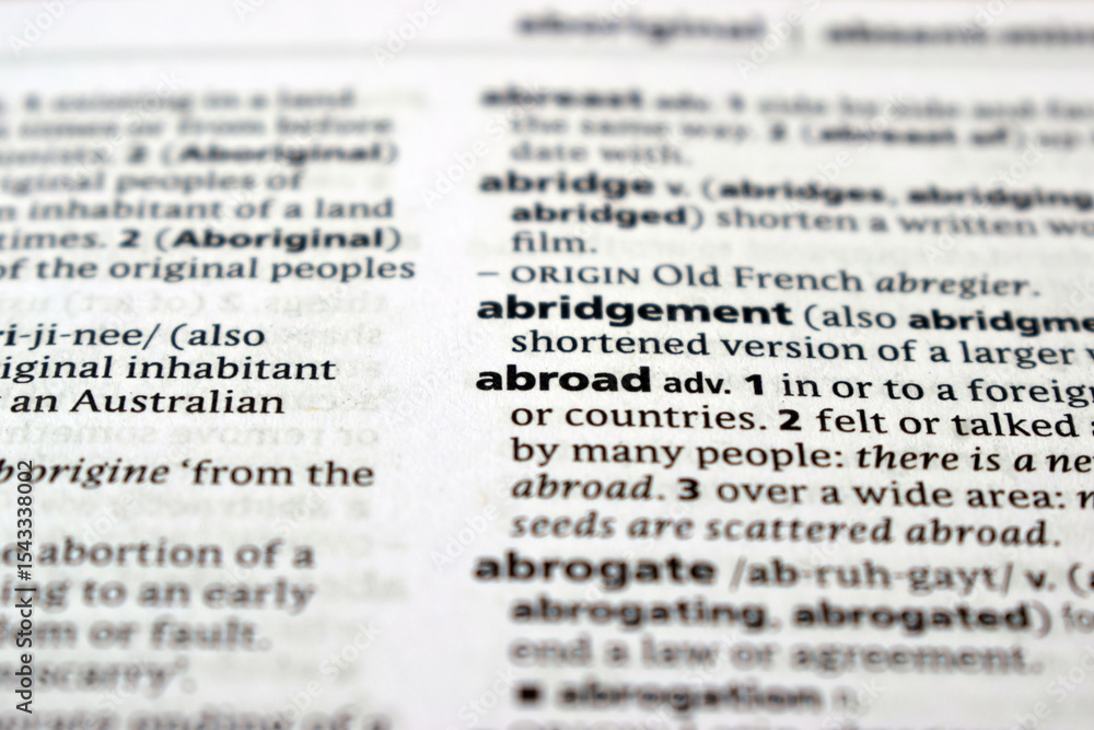 Close Up Of English Dictionary Page With Word - Abroad Close Up Of English Dictionary Page With Word - Abroad