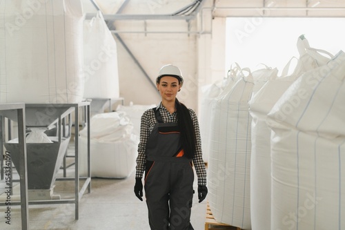 Photography Female engineer inspecting production in a flour mill